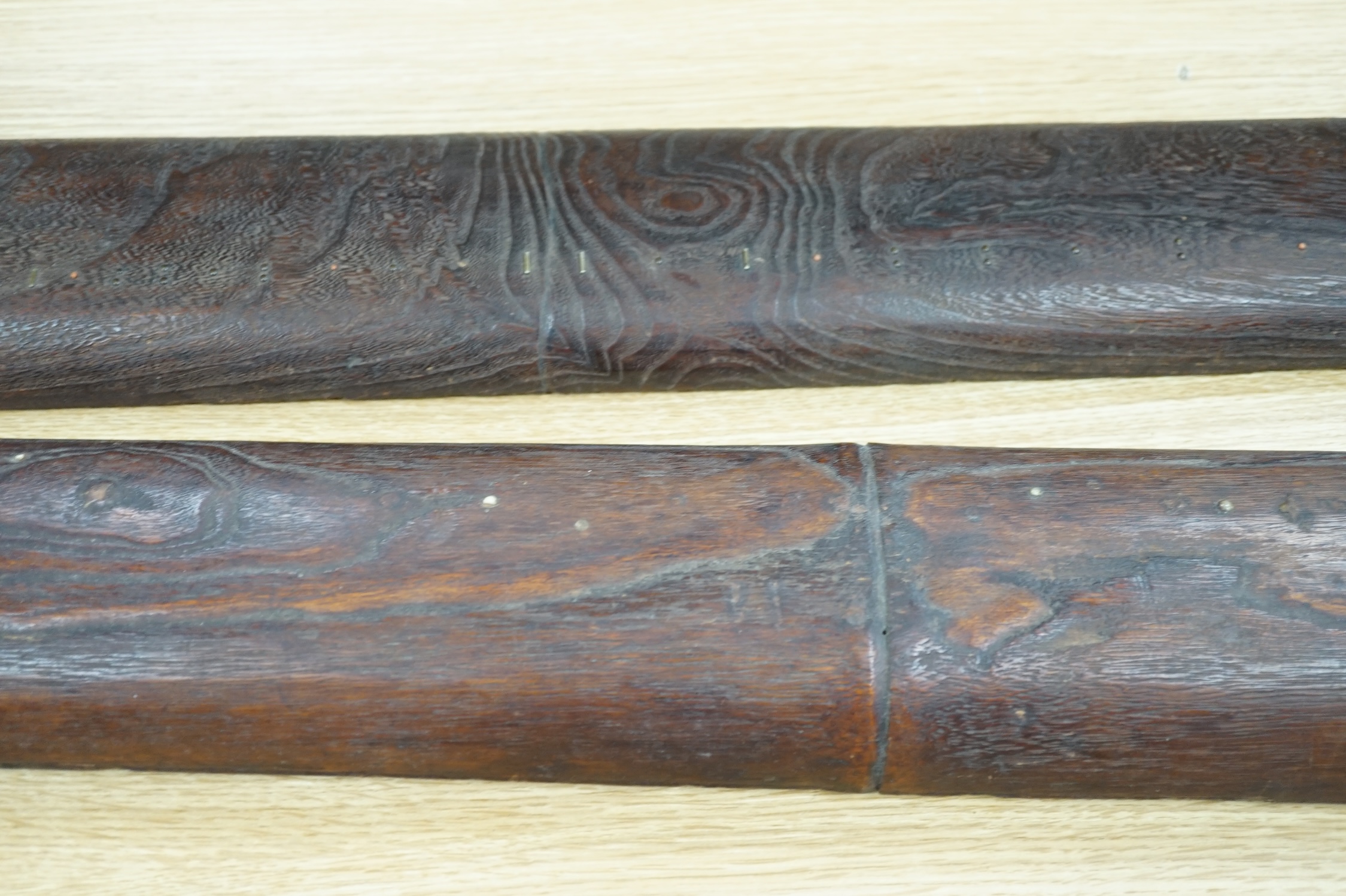 Two Japanese musical instruments and a stand, together with three catalogues, instruments 108cm long